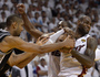 LeBron James, right, of the Miami Heat snatches the ball from Tim Duncan, left, of the San Antonio Spurs during overtime in Game 6 of the NBA Finals at the American Airlines Arena in Miami.