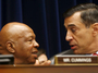 House Oversight and Government Reform Committee Chairman Darrell Issa (right) speaks with the committee's ranking Democrat, Elijah Cummings, earlier this month, during a hearing on IRS conference spending.