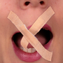 A woman with tape over her mouth.