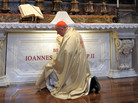 Cardinal Stanislav Dziwisz, archbishop of Krakow and former personal secretary of Pope John Paul II, prays in front of the late pope's tomb at St. Peter's Basilica in 2011, in Vatican City. Cardinal Stanislav Dziwisz, archbishop of Krakow and former personal secretary of Pope John Paul II, prays in front of the late pope's tomb at St. Peter's Basilica in 2011, in Vatican City.