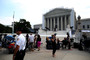 Members of the media wait for court rulings in front of the U.S. Supreme Court building on Monday in Washington DC.