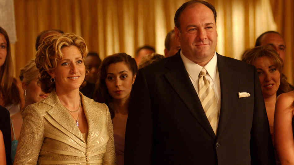 James Gandolfini as Tony Soprano and Edie Falco as his wife, Carmella, in a scene from The Sopranos. Gandolfini died of cardiac arrest in Italy, according to reports citing a doctor at the hospital where was admitted. James Gandolfini as Tony Soprano and Edie Falco as his wife, Carmella, in a scene from The Sopranos. Gandolfini died of cardiac arrest in Italy, according to reports citing a doctor at the hospital where was admitted.