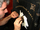 Safe cracker Elaad Israeli works the dial on an old safe found by the National Council of Women of the United States. Safe cracker Elaad Israeli works the dial on an old safe found by the National Council of Women of the United States.