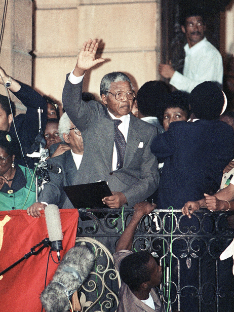 Several hours after his release from prison, Nelson Mandela made his first speech on the balcony of Cape Town's City Hall. As he prepared to speak, he realized he had left his glasses in the prison. So he borrowed a pair from his wife Winnie. Several hours after his release from prison, Nelson Mandela made his first speech on the balcony of Cape Town's City Hall. As he prepared to speak, he realized he had left his glasses in the prison. So he borrowed a pair from his wife Winnie.