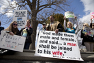 Allan Hoyle of North Carolina (center) protests gay marriage outside the Supreme Court. Allan Hoyle of North Carolina (center) protests gay marriage outside the Supreme Court.