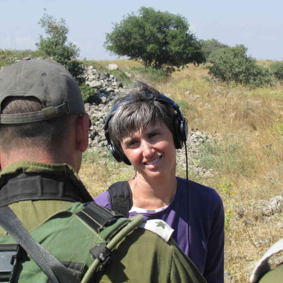 NPR International Correspondent Emily Harris interviewing a commander during an Isralie military exercise in northern Israel. NPR International Correspondent Emily Harris interviewing a commander during an Isralie military exercise in northern Israel.