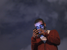An anti-government protester wearing a gas mask uses a cellphone to read the news on social media as demonstrators gather at midnight in Istanbul's Taksim Gezi Park on June 13. An anti-government protester wearing a gas mask uses a cellphone to read the news on social media as demonstrators gather at midnight in Istanbul's Taksim Gezi Park on June 13.