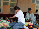 Nurse Tina Martin checks on Orion Qurbonaliev, 4, who has tuberculosis. Orion's grandmother, Kholbibi Abdulloeva, also has TB. Nurse Tina Martin checks on Orion Qurbonaliev, 4, who has tuberculosis. Orion's grandmother, Kholbibi Abdulloeva, also has TB.
