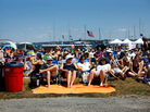 These Newport Folk Festival fans knew well enough to position themselves a ways back from the stage. These Newport Folk Festival fans knew well enough to position themselves a ways back from the stage.
