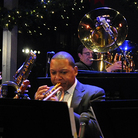 Louis Armstrong Continuum on stage. Co-leader Vince Giordano is on tuba in the back row. Louis Armstrong Continuum on stage. Co-leader Vince Giordano is on tuba in the back row.