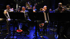Louis Armstrong Continuum on stage. Co-leader Vince Giordano is on tuba in the back row. Louis Armstrong Continuum on stage. Co-leader Vince Giordano is on tuba in the back row.