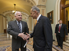 The Senate has passed a sweeping immigration bill, widely seen as the product of the "Gang of 8," a group that includes Sens. John McCain, R-Ariz. (left), and Sen. Chuck Schumer, D-N.Y. The two shook hands before Thursday's final vote. The Senate has passed a sweeping immigration bill, widely seen as the product of the "Gang of 8," a group that includes Sens. John McCain, R-Ariz. (left), and Sen. Chuck Schumer, D-N.Y. The two shook hands before Thursday's final vote.