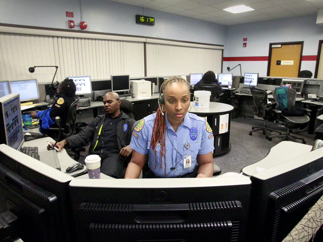 Miami Police Department dispatcher Shekita Johnson and officer Ernest Lawrence staff the boards at Miami's Communications Unit. Call-takers in the unit screen the 911 calls, then send them to dispatchers. Miami Police Department dispatcher Shekita Johnson and officer Ernest Lawrence staff the boards at Miami's Communications Unit. Call-takers in the unit screen the 911 calls, then send them to dispatchers.