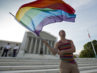 Gay rights advocate Vin Testa waves a rainbow flag in front of the Supreme Court on June 26, 2013. Gay rights advocate Vin Testa waves a rainbow flag in front of the Supreme Court on June 26, 2013.
