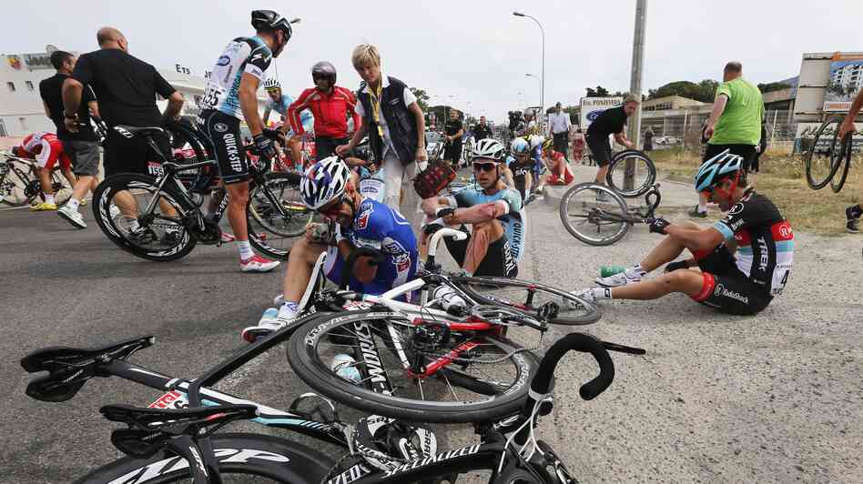 Riders and bicycles were spread across the road after one of the crashes Saturday during Stage 1 of the Tour de France, which began in Corsica. Riders and bicycles were spread across the road after one of the crashes Saturday during Stage 1 of the Tour de France, which began in Corsica.