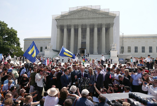 One of the attorneys in the California Proposition 8 case, David Boies (center), speaks outside the Supreme Court as he's surrounded by plaintiffs in the case, couples Paul Katami (from left) and Jeff Zarrillo, and Sandy Stier and Kris Perry. (Image credit: Getty Images)