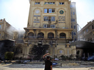 An Egyptian protester looks at the damaged Muslim Brotherhood headquarters in Cairo. Protesters stormed and ransacked the headquarters early Monday, in an attack that could spark more violence as demonstrators gear up for a second day of mass rallies. An Egyptian protester looks at the damaged Muslim Brotherhood headquarters in Cairo. Protesters stormed and ransacked the headquarters early Monday, in an attack that could spark more violence as demonstrators gear up for a second day of mass rallies.