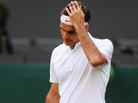 Roger Federer of Switzerland reacts during his Gentlemen's Singles second round match against Sergiy Stakhovsky of Ukraine on day three of the Wimbledon Lawn Tennis Championships at the All England Lawn Tennis and Croquet Club on June 26. Roger Federer of Switzerland reacts during his Gentlemen's Singles second round match against Sergiy Stakhovsky of Ukraine on day three of the Wimbledon Lawn Tennis Championships at the All England Lawn Tennis and Croquet Club on June 26.