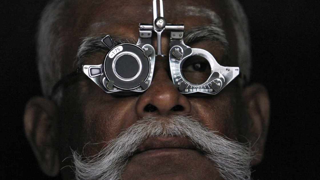 A man gets an eye exam at an Aravind Eye Care clinic in Madurai, India.