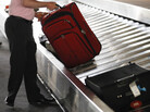 A traveler collects his bag from a luggage carousel in the Philadelphia International Airport in 2011. Baggage fees have helped financially desperate carriers stay aloft. A traveler collects his bag from a luggage carousel in the Philadelphia International Airport in 2011. Baggage fees have helped financially desperate carriers stay aloft.