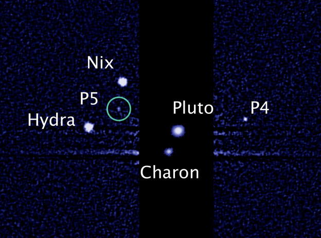 Pluto's two newest moons, designated as P4 and P5 in this image from the Hubble Space Telescope, will now be called Kerberos and Styx. (Image credit: NASA/ESA)