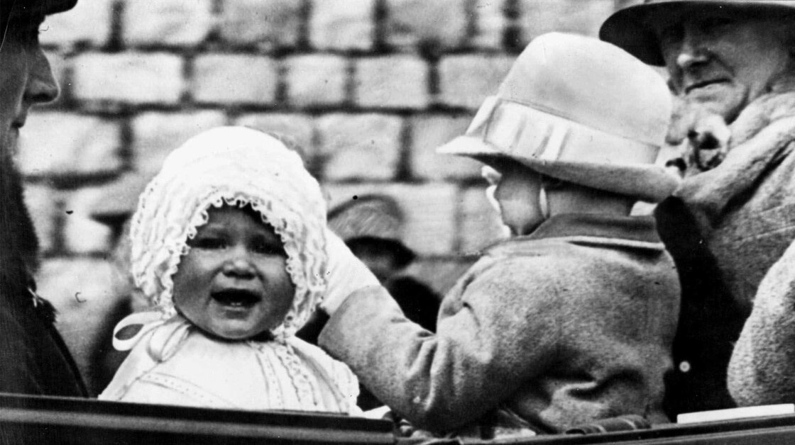 Little Princess Elizabeth takes a ride on the grounds of Windsor Castle in 1927 with her cousin, Gerald Lascelles.