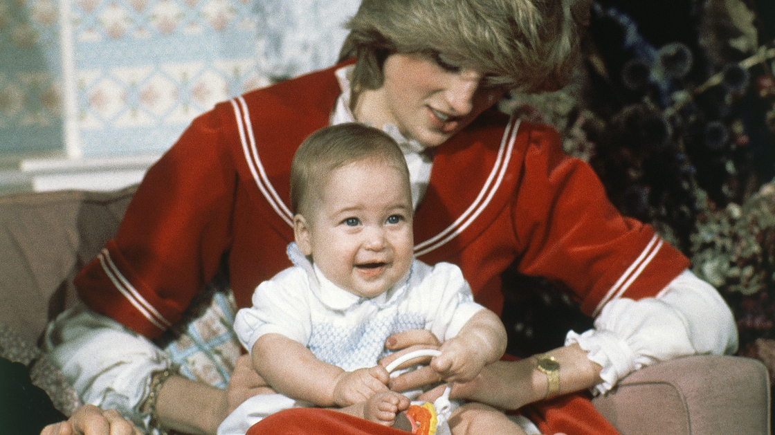 Britain's Prince William, the 6-month-old son of Prince Charles and Princess Diana, sits on his mother's knee at Kensington Palace in London on Dec. 22, 1982.