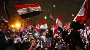 Protesters in Cairo's Tahrir Square react after President Mohammed Morsi was ousted by the military on Wednesday. The head of Egypt's armed forces, Gen. Abdel Fattah al-Sisi, issued a declaration suspending the constitution and appointing Egypt's chief justice as interim head of state.