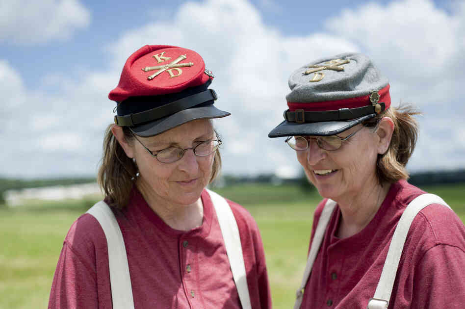 Carole Hackett (left) and her twin sister, Cheryl Hackett, from West Virginia, participated in the re-enactment as part of the Confederate Army artillery. Carole Hackett (left) and her twin sister, Cheryl Hackett, from West Virginia, participated in the re-enactment as part of the Confederate Army artillery.