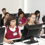 New employees train for call center work at Teleperformance Portugal, an outsourcing company in Lisbon. The outsourcing industry is adding thousands of jobs while other Portuguese industries shed them.