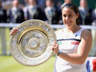France's Marion Bartoli celebrates her women's singles championship at The All England Lawn Tennis and Croquet Club in Wimbledon. France's Marion Bartoli celebrates her women's singles championship at The All England Lawn Tennis and Croquet Club in Wimbledon.
