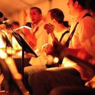 Some of the 200 guitarists who took part in Rhys Chatham's A Crimson Grail at Lincoln Center's Out of Doors Festival in August 2009. Some of the 200 guitarists who took part in Rhys Chatham's A Crimson Grail at Lincoln Center's Out of Doors Festival in August 2009.