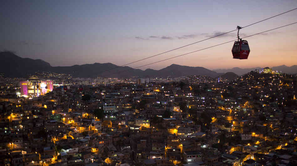 Cable cars move commuters over a complex of shantytowns in Rio de Janeiro, one of many cities taking part in the smart city boom around the world. Cable cars move commuters over a complex of shantytowns in Rio de Janeiro, one of many cities taking part in the smart city boom around the world.