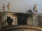Firemen battle flames at the 17th century Hotel Lambert early Wednesday in Paris. Firemen battle flames at the 17th century Hotel Lambert early Wednesday in Paris.