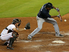 Julio Teheran of the Atlanta Braves bunts during a game against the Miami Marlins at Marlins Park on July 9, 2013 in Miami, Florida. Julio Teheran of the Atlanta Braves bunts during a game against the Miami Marlins at Marlins Park on July 9, 2013 in Miami, Florida.