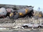 A police photograph shows burned and wrecked crude oil carrying rail tankers piled up in Lac-Megantic, Quebec, on Monday. Dozens of people died in the disaster. A police photograph shows burned and wrecked crude oil carrying rail tankers piled up in Lac-Megantic, Quebec, on Monday. Dozens of people died in the disaster.
