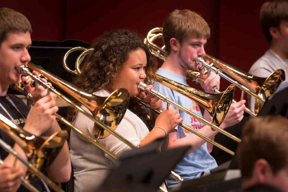 "The first rehearsal, I was speechless," says trombonist Skye Dearborn (center). "The first rehearsal, I was speechless," says trombonist Skye Dearborn (center).