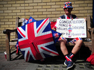 Royal well-wisher Terry Hutt poses for a picture as he waits outside the Lindo Wing of Saint Mary's Hospital in London on Friday. Royal well-wisher Terry Hutt poses for a picture as he waits outside the Lindo Wing of Saint Mary's Hospital in London on Friday.