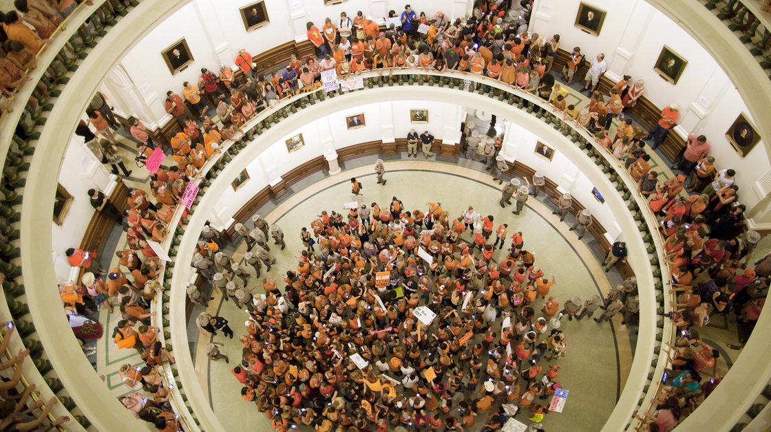 Abortion rights advocates fill the rotunda of the State Capitol as the Senate neared its vote Friday night.