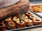 Chef Dominique Ansel makes cronuts, a croissant-donut hybrid, at his New York bakery in June. Chef Dominique Ansel makes cronuts, a croissant-donut hybrid, at his New York bakery in June.
