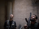 Rebel fighters take positions during clashes with pro-government forces in Aleppo earlier this month. Rebel fighters take positions during clashes with pro-government forces in Aleppo earlier this month.