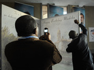 A man signs a large birthday card at Loftus Stadium in Pretoria for ailing former South African President Nelson Mandela's upcoming July 18 birthday. 'Madiba' is Mandela's clan name. A man signs a large birthday card at Loftus Stadium in Pretoria for ailing former South African President Nelson Mandela's upcoming July 18 birthday. 'Madiba' is Mandela's clan name.
