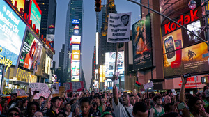 Marchers in New York's Times Square Sunday protest the acquittal of George Zimmerman in the killing of 17-year-old Trayvon Martin in Sanford, Fla.
