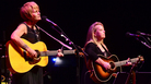 Shawn Colvin (left) and Mary Chapin Carpenter perform together on stage. Shawn Colvin (left) and Mary Chapin Carpenter perform together on stage.