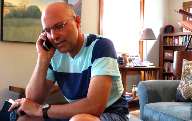 Brian Mathers calls his husband, Isidro, in Mexico from his living room in Sioux City, Iowa. Brian and Isidro have been separated for more than a year by immigration laws that did not recognize their marriage. (Image credit: NPR)
