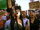 Pinto leads protesters in song during anti-austerity demonstrations. "I'm just a normal citizen," she says. "I just have this strong instinct of protecting what I love, and I do deeply love my country." Pinto leads protesters in song during anti-austerity demonstrations. "I'm just a normal citizen," she says. "I just have this strong instinct of protecting what I love, and I do deeply love my country."