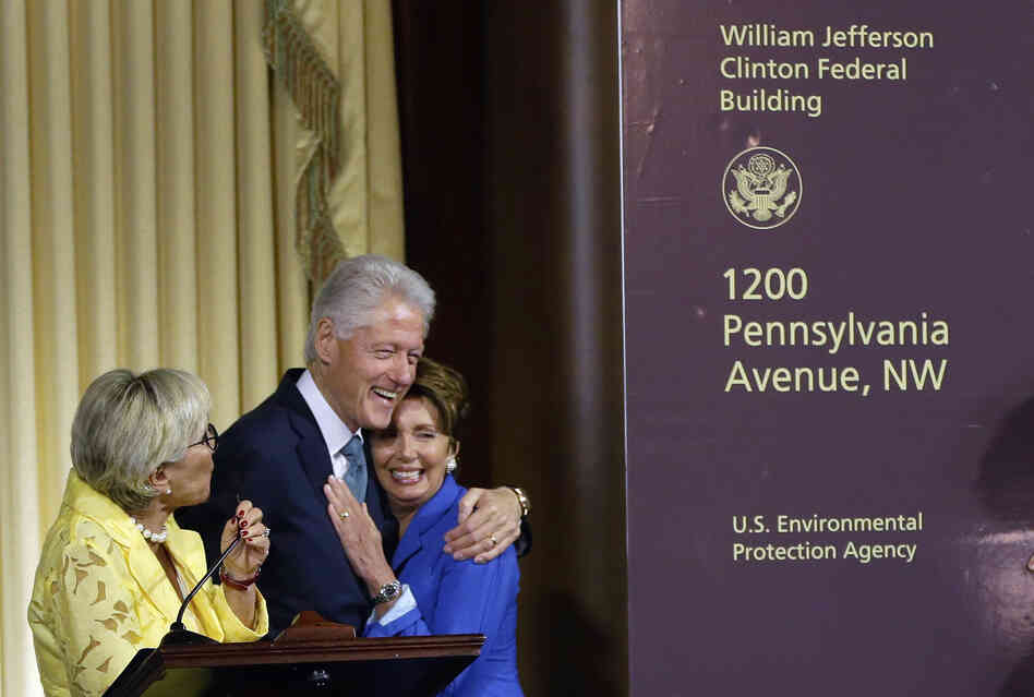 Former President Bill Clinton hugs House Minority Leader Nancy Pelosi of California as another Democrat, Sen. Barbara Boxer of California, looks on at Wednesday's ceremony naming the Environmental Protection Agency headquarters for him. Former President Bill Clinton hugs House Minority Leader Nancy Pelosi of California as another Democrat, Sen. Barbara Boxer of California, looks on at Wednesday's ceremony naming the Environmental Protection Agency headquarters for him.