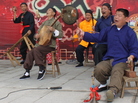 Zhang Junmin (second from right) and his band perform the Lao Qiang music special in northwest China's Shaanxi province. The character behind the stage means "drama"; Lao Qiang music used to accompany puppet plays and includes a strong storytelling component. Zhang Junmin (second from right) and his band perform the Lao Qiang music special in northwest China's Shaanxi province. The character behind the stage means "drama"; Lao Qiang music used to accompany puppet plays and includes a strong storytelling component.