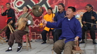 Zhang Junmin (second from right) and his band perform the Lao Qiang music special in northwest China's Shaanxi province. The character behind the stage means "drama"; Lao Qiang music used to accompany puppet plays and includes a strong storytelling component. Zhang Junmin (second from right) and his band perform the Lao Qiang music special in northwest China's Shaanxi province. The character behind the stage means "drama"; Lao Qiang music used to accompany puppet plays and includes a strong storytelling component.