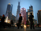 In a global survey, many respondents believe that China has overtaken or eventually will overtake the U.S. as the world's leading superpower. Chinese are shown here walking in Shanghai's financial district in March. In a global survey, many respondents believe that China has overtaken or eventually will overtake the U.S. as the world's leading superpower. Chinese are shown here walking in Shanghai's financial district in March.